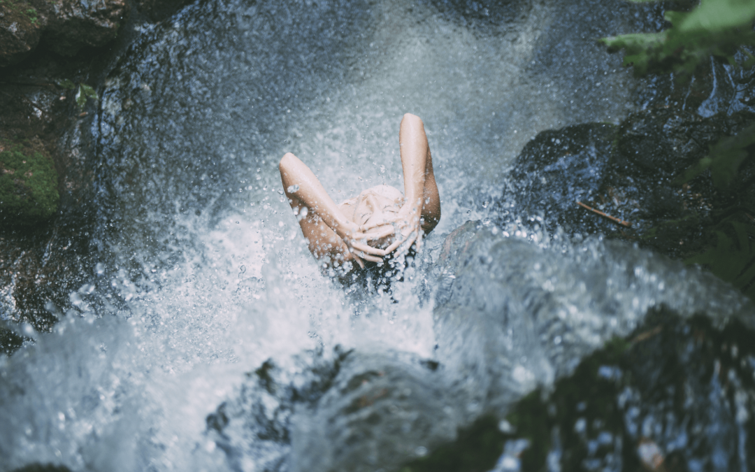 Cold shower in waterfall